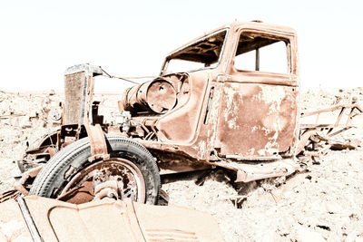 Old abandoned truck on field