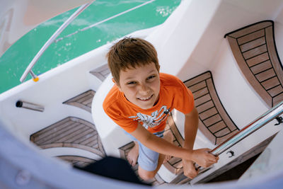 High angle view of boy playing in water