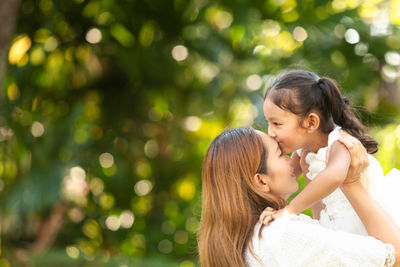 Mother and daughter outdoors