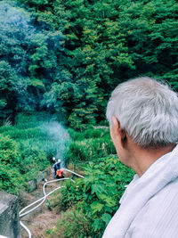 Rear view of man in forest