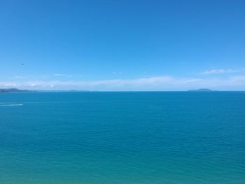 Scenic view of sea against blue sky