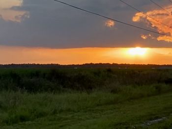 Scenic view of landscape against sky during sunset