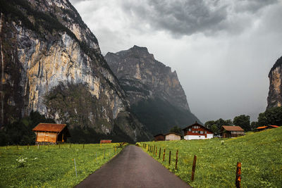 Lauterbrunnen valley, switzerland. swiss alps. road in mountains. wooden houses, traditional chalet.