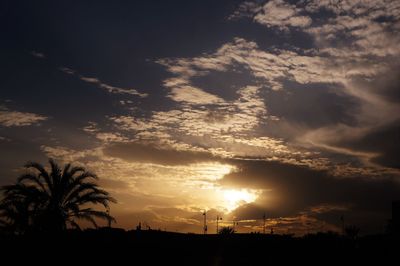 Scenic view of silhouette landscape against sky at sunset