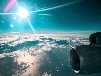 Aerial view of airplane flying in sky