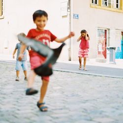 Full length of happy boy running