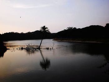 Scenic view of lake against sky during sunset