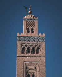 Low angle view of building against blue sky