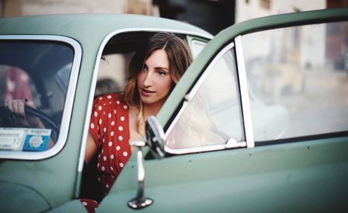 Close-up of man holding car