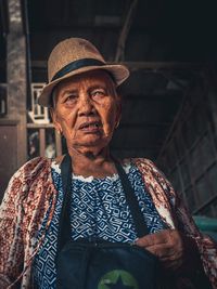 Portrait of man wearing hat standing outdoors