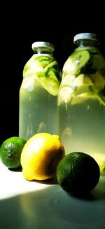 Close-up of fruits in jar on table