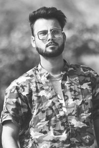 Portrait of young man standing outdoors