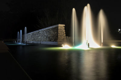 Nice rock wall with guiding lines surrounded by a colorful cascading fountain.