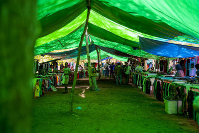 Group of people at market stall