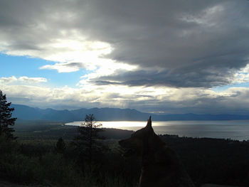 Scenic view of sea against cloudy sky