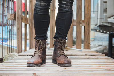 Low section of man standing on footpath