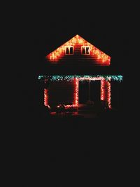 Low angle view of illuminated building at night