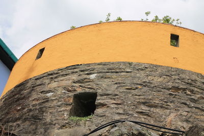 Low angle view of old building against sky