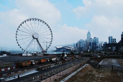 Ferris wheel against cloudy sky