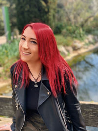 Portrait of smiling woman with redhead