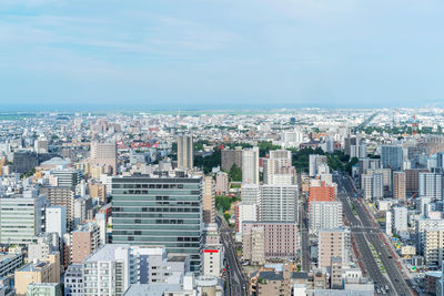 High angle view of buildings against sky in city