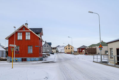 Houses in town against clear sky