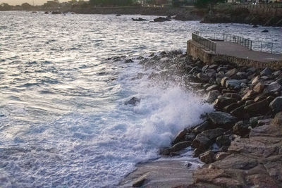 Sea waves splashing on rocks