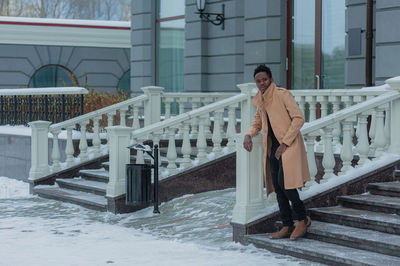 Man looking away while standing outdoors