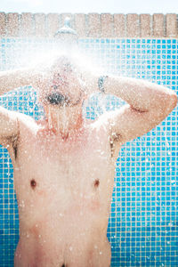 High angle view of man swimming in pool