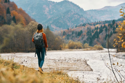 Rear view of man looking at mountains