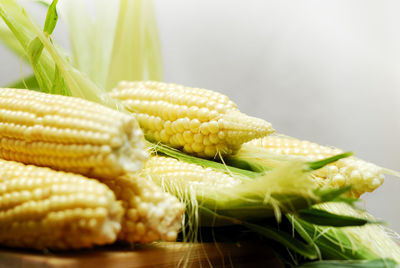 Close-up of sweetcorns on table