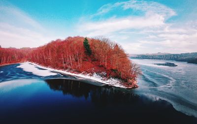 Scenic view of lake against sky during winter
