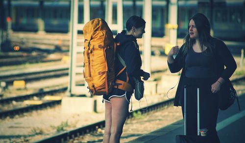 Woman with umbrella walking in city