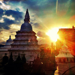 Silhouette of temple against sky during sunset