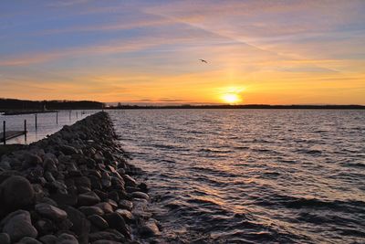 Scenic view of sea against sky during sunset