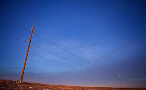 Scenic view of landscape against blue sky