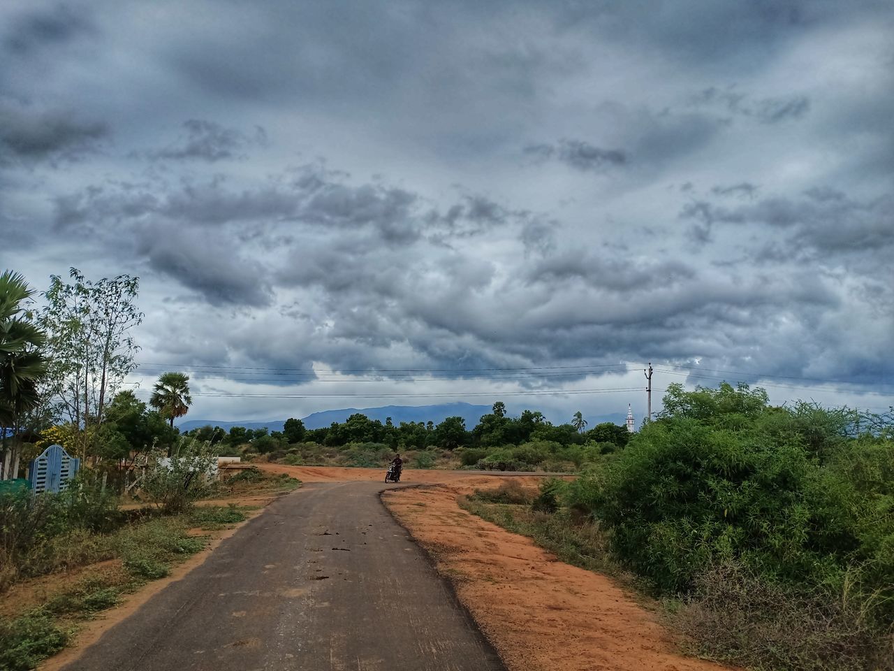 ROAD PASSING THROUGH LANDSCAPE AGAINST SKY