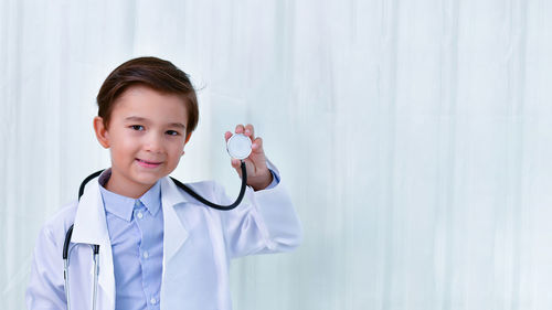 Portrait of boy dressed up as doctor