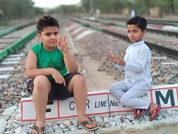 Boy sitting outdoors