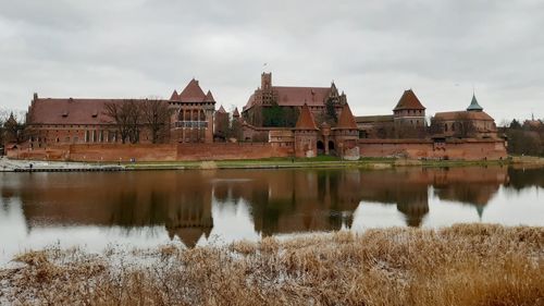 Castle of malbork on a cloudy winter day