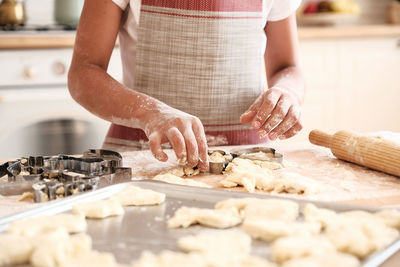 Midsection of person preparing food at home