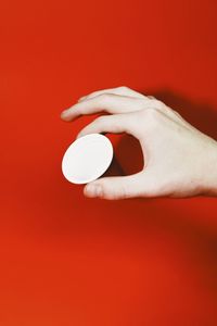 Close-up of hand over white background