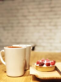 Close-up of coffee cup on table