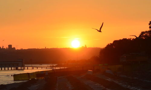 Scenic view of sunset over city