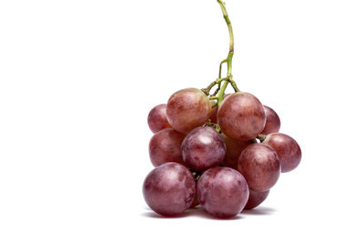 Close-up of cherries against white background