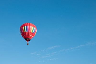 Hot air balloons flying at sunset