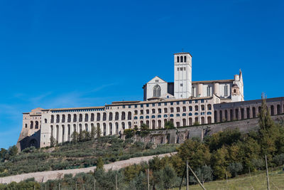 Low angle view of historical building against blue sky