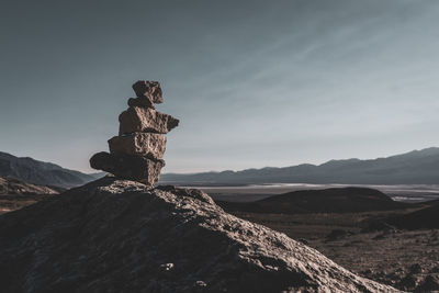 Stack of rocks against sky