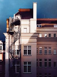 Spiral staircase on facade of building