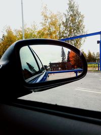 Reflection of car on side-view mirror